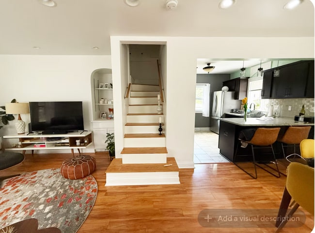 Living room staircase - 10922 W Wells St