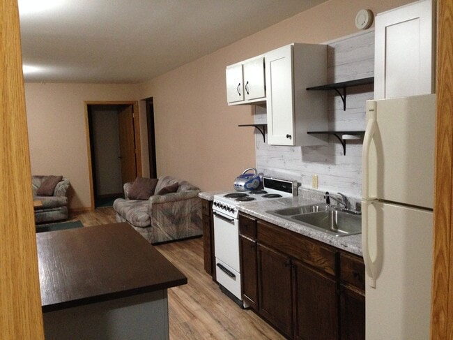 Kitchen with open concept dining and living rooms. - 7680 Birchmont Beach Rd NE