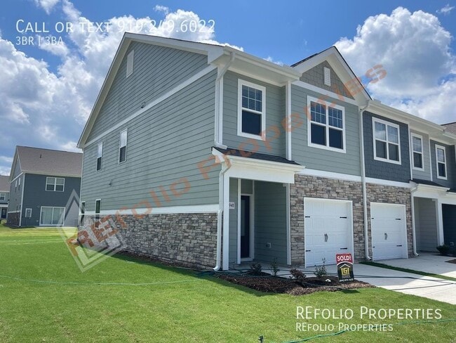 Building Photo - Brand New 3 Bedroom 1-Car Garage End Unit ...