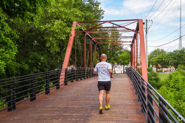 Resident jogging on The Historic Rogers Street Bridge in Waxahachie, TX.