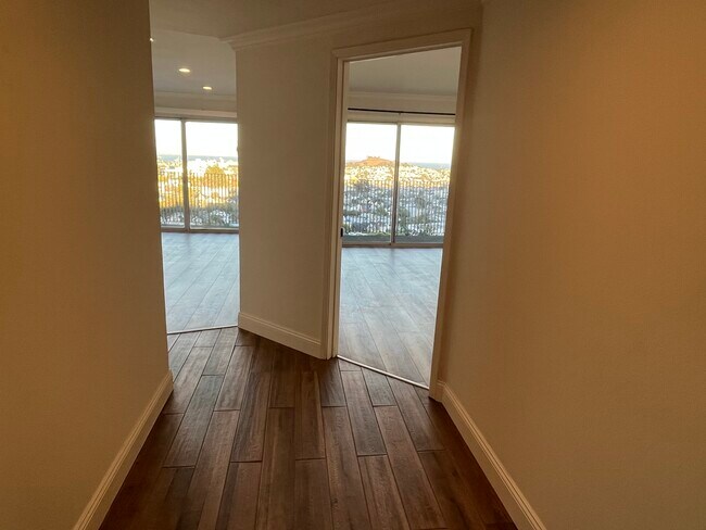 First steps into the apartment, living room to the left, bedroom to the right - 3639 Market St