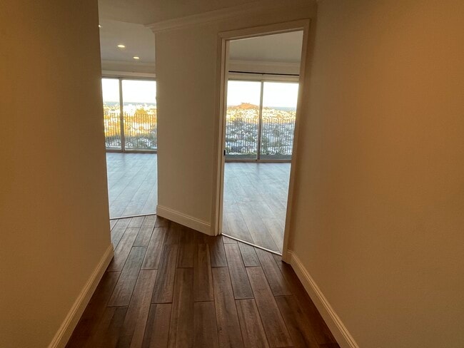 First steps into the apartment, living room to the left, bedroom to the right - 3639 Market St
