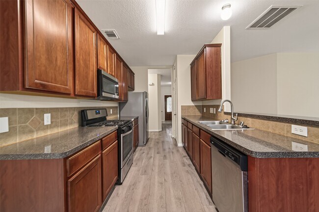 Foto del edificio - 5107 Moss Garden Ln