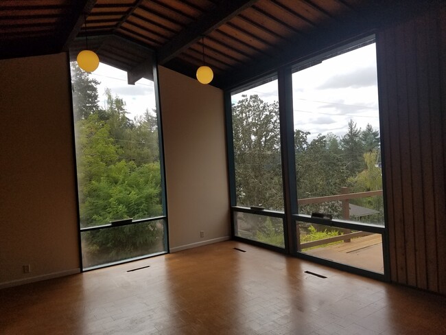 Building Photo - Unique Hillside Campus Home w/Floor to Cei...