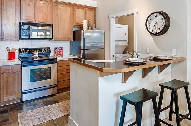 Laundry and extra storage in side room. - 7720 Greenwood Ave N