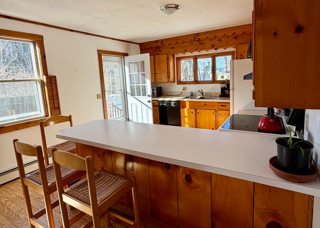 kitchen with door out to deck - 34 Boody St