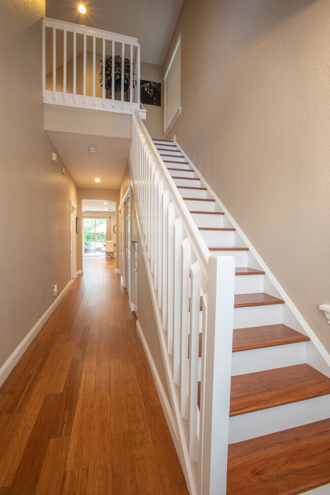 Enter in the foyer with 20 foot ceilings and wide hallway. Warm wood floors and natural light. - 2811 Frederick Blvd
