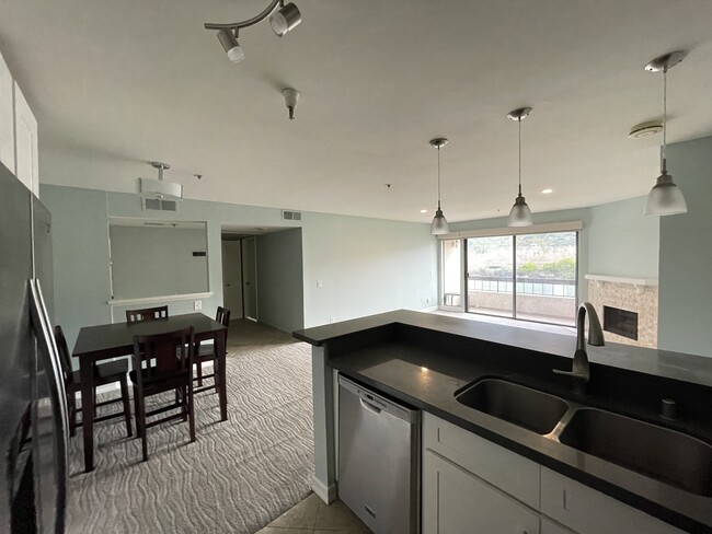 Kitchen and living room, from kitchen - 5665 Friars Rd