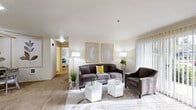 Located at 4300 Goodpasture Loop in Eugene, Oregon, this two-bedroom, one-bathroom residence offers a thoughtfully laid-out single-level floor plan. The living room serves as the heart of the home, featuring soft carpet flooring, large vertical-blind windows that invite natural light, and a welcoming, neutral color palette throughout. A hardwood-style entryway at the front door adds a practical touch at the main entrance.

The combined dining room and kitchen area is efficiently designed, with the kitchen showcasing white cabinetry, wood-look flooring, a full suite of appliances including a dishwasher and refrigerator, and direct access to the dedicated in-unit laundry space, which includes overhead storage cabinets. The dining area is defined by a ceiling fan overhead, providing both comfort and character.

The primary bedroom is a comfortable retreat featuring a built-in vanity with a large mirror and ample cabinetry, alongside a mirrored sliding-door closet with built-in shelving. The full bathroom includes wood-look flooring, a single-sink vanity with under-cabinet storage, a well-lit mirror, and a full-size soaking tub with shower. The second bedroom offers additional flexible living space. Together, the rooms create a cohesive, functional, and bright living environment.