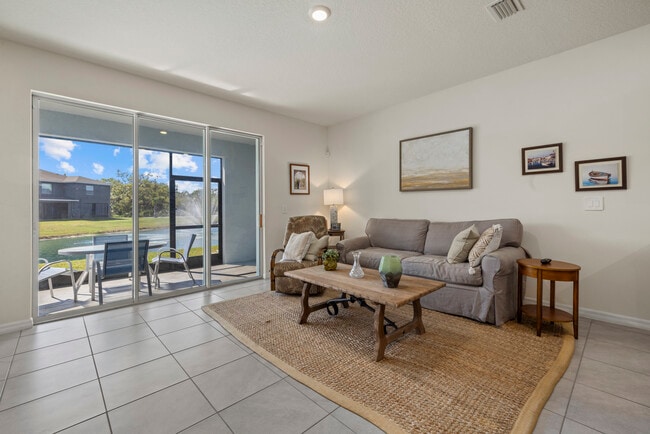 Living room and back patio with water fountain - 8995 Milestone Dr