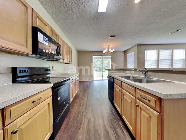 Building Photo - 11293 Justin Oaks Dr N