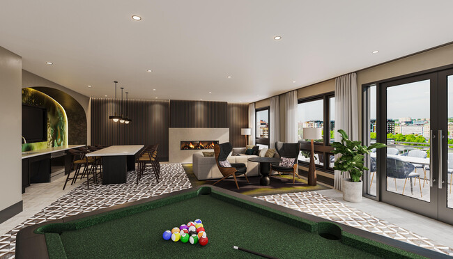 Rooftop lounge with billiards, fireplace, and outdoor terrace with sweeping views towards the Capitol. - Modera H Street