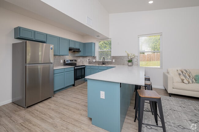 Common Area - Furnished Kitchen Island With Bar Chairs - 1100-1110 E Hurd St