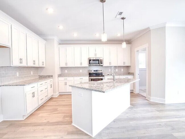 Building Photo - Situated on over 3 acres right in a growin...