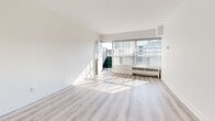 Located at 494 Avenue Rd in Toronto's desirable midtown neighbourhood, this well-appointed unit offers a thoughtfully organized single-floor layout that maximizes its available space. The entrance leads into a light-filled interior finished with clean white walls and light wood-tone laminate flooring throughout the main living areas.

The living room is a standout feature, boasting large floor-to-ceiling windows with vertical blinds that flood the room with natural light and provide direct access to a private balcony with outdoor views. The adjacent dining room continues the open, airy feel with the same flooring and neutral palette.

The compact kitchen is efficiently designed, featuring white cabinetry with modern brushed hardware, a subway tile backsplash, laminate countertops, and full-sized appliances including a refrigerator and electric range. Light tile flooring completes the practical finish.

The bathroom is clean and classic, with white square wall tiles surrounding a full bathtub and shower, complemented by tile flooring and a mirrored medicine cabinet. Two closets — including one with mirrored sliding doors — provide ample storage throughout. The space is bright, functional, and move-in ready.