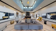 This thoughtfully designed community clubhouse offers a welcoming and sophisticated environment across a single, well-appointed floor. The centerpiece of the space is a grand open lounge area distinguished by dramatic double-height ceilings, a bold teal upper-wall accent, and clerestory windows that flood the room with natural light. Light-toned wood-look tile flooring runs throughout, lending continuity and warmth to every area.

The main lounge is furnished with a generous sectional sofa accented by patterned throw pillows, vibrant mustard-yellow accent chairs, and curated abstract artwork, creating an inviting social atmosphere. A striking dark brick fireplace column anchors the far end of the room, complemented by a reception or service counter.

Adjacent to the main lounge, a fully equipped kitchenette features rich dark wood cabinetry, light stone countertops, a stainless steel refrigerator, and an undermount sink — ideal for community events and gatherings. A separate dining area accommodates a large conference-style table with seating for several guests, bathed in natural light from oversized windows overlooking the outdoor area.

A cozy banquette nook with tufted leather bench seating and eclectic wall décor provides an intimate setting for smaller gatherings. Additional flexible seating areas and glass-paned interior doors connect the various zones seamlessly, reinforcing the clubhouse's open, communal character.