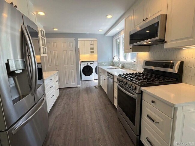 Foto del edificio - 8 Tree Hollow Ln