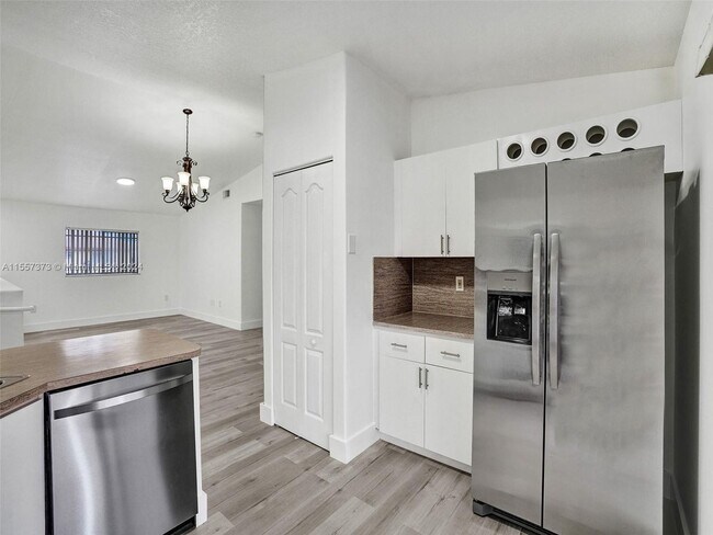 Building Photo - 11001 W Okeechobee Road 201, Hialeah Garde...