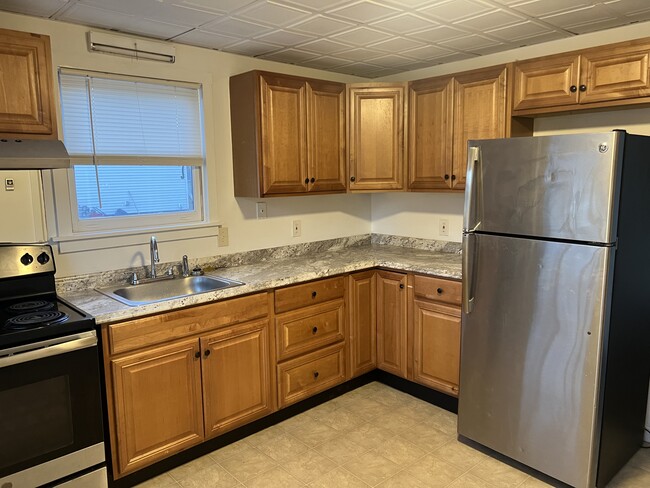 Kitchen with newer appliances and cabinets - 18 First St