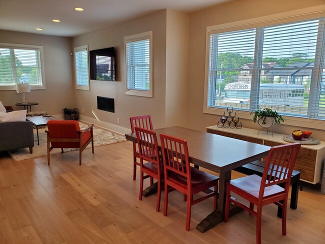 Living room has a gas fireplace with remote control for extra warmth and charm. - 1021 Cheatham Pl