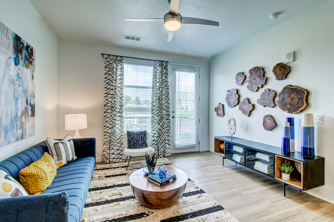 Open-concept living area with luxury vinyl plank flooring - Avalon Flatirons