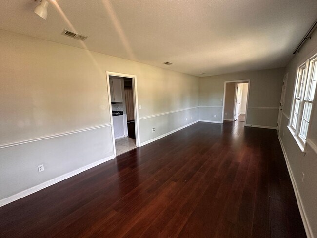 Building Photo - Three Bedroom Home with Fenced Private Yard