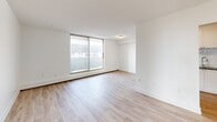 This contemporary apartment, located at 1200 Talwood Crt in Peterborough, ON, offers 1010 square feet of thoughtfully designed living space. The single-story layout comprises three bedrooms, including a spacious 160 sq ft primary bedroom, two bathrooms, and an inviting open-concept living area. The modern kitchen boasts sleek white cabinetry, stainless steel appliances, and a subway tile backsplash, creating a stylish and functional cooking space. Light wood-look flooring runs throughout, complementing the crisp white walls and enhancing the overall bright and airy ambiance. Large windows in the living room and bedrooms flood the space with natural light, while a private balcony extends the living area outdoors. The bathrooms feature clean lines with white fixtures and tiled surfaces. Additional amenities include ample closet space and baseboard heating for year-round comfort. This well-appointed apartment combines contemporary design with practical living, perfect for those seeking a modern urban lifestyle in Peterborough.