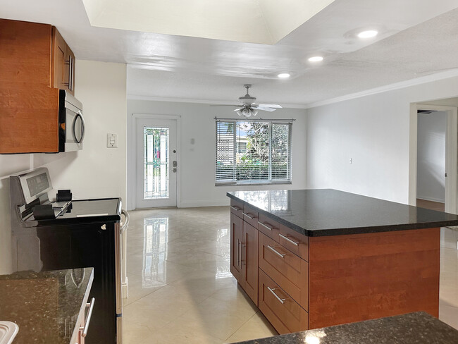 View from kitchen looking into living room - 6001 NW 71st Ave