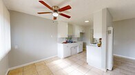 Located at 3814 Baldwin Ave in El Monte, CA, this single-story, one-bedroom, one-bathroom unit offers a thoughtfully organized layout across a compact but functional floor plan. Light-toned tile flooring runs throughout the main living areas, lending a cohesive and clean aesthetic. The living room welcomes natural light through large windows fitted with vertical blinds, and features a ceiling fan overhead alongside a wall-mounted heating unit. It flows naturally into the designated dining area, creating an open, connected feel. The galley-style kitchen is well-appointed with white cabinetry, tile countertops, a gas range, and a double sink with a tile backsplash — all illuminated by a ceiling fan and a window that brings in additional natural light. The bedroom offers a comfortable footprint with a sliding double-door closet, a window with vertical blinds, and a wall AC unit for climate control. Textured ceilings are present throughout. The bathroom includes a tiled tub-and-shower combination with marble-style wall tile, a white vanity, and a window for ventilation. Two closets provide additional storage. The overall palette of soft grays, whites, and neutral tones gives the space a clean, move-in-ready appearance.