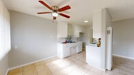 Located at 3814 Baldwin Ave in El Monte, CA, this single-story, one-bedroom, one-bathroom unit offers a thoughtfully organized layout across a compact but functional floor plan. Light-toned tile flooring runs throughout the main living areas, lending a cohesive and clean aesthetic. The living room welcomes natural light through large windows fitted with vertical blinds, and features a ceiling fan overhead alongside a wall-mounted heating unit. It flows naturally into the designated dining area, creating an open, connected feel. The galley-style kitchen is well-appointed with white cabinetry, tile countertops, a gas range, and a double sink with a tile backsplash — all illuminated by a ceiling fan and a window that brings in additional natural light. The bedroom offers a comfortable footprint with a sliding double-door closet, a window with vertical blinds, and a wall AC unit for climate control. Textured ceilings are present throughout. The bathroom includes a tiled tub-and-shower combination with marble-style wall tile, a white vanity, and a window for ventilation. Two closets provide additional storage. The overall palette of soft grays, whites, and neutral tones gives the space a clean, move-in-ready appearance.