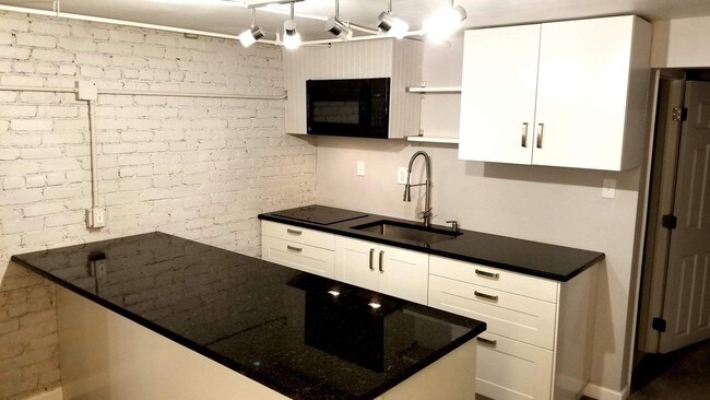 Updated kitchen w/ granite countertops. - 1031 Monroe St