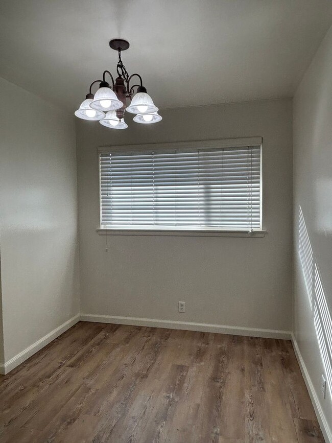 Building Photo - Updated 3 bedroom 2 bathroom home with large backyard, corner lot, close to shopping and schools ...