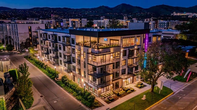 Liberty Duet Apartments, Salt Lake City, Utah; exterior well-lit front at night. - Liberty Duet