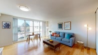 Located at 10 De Sabla Rd in San Mateo, California, this single-floor residence offers a well-organized layout with a clean, modern sensibility. The open living and dining area serves as the heart of the home, showcasing warm hardwood flooring that runs throughout the main living spaces. Large windows flood the room with abundant natural light and offer pleasant outdoor views, creating an airy and inviting atmosphere. The living area accommodates both a comfortable seating arrangement and a dedicated dining space, making it well-suited for everyday living and entertaining.

The entryway features a sliding closet for storage, a decorative console table with a round mirror, and a coat rack, providing a welcoming and organized transition into the home. The kitchen is equipped with wood-toned cabinetry, a full-size refrigerator, and granite-style countertops, offering practical functionality. The bedroom is a spacious, carpeted retreat with a large window that frames views of surrounding greenery and brings in soft natural light. A closet with ample storage is accessible directly from the bedroom. Throughout the residence, the design maintains a cohesive, understated palette of neutral tones accented by warm wood finishes, contributing to a calm and comfortable living environment.