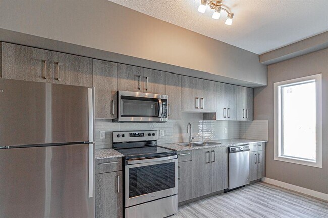 Photo du bâtiment - 4641-2128 128 Ave NE