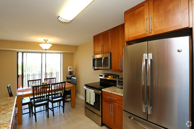 Private Balcony accessed from the Kitchen. - Americana Apartments