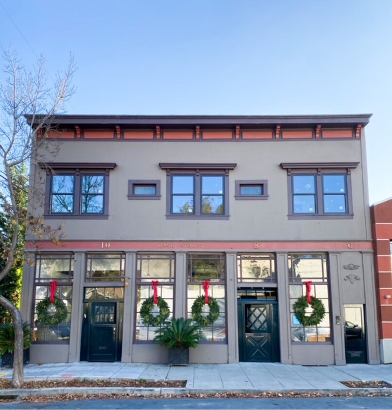 Exterior of the building. Apartment spans entire width of the building on the second floor. - 6 Bank St