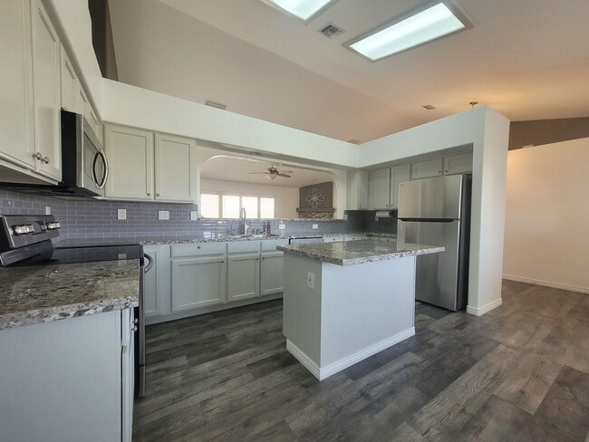 Building Photo - ChatGPT said: Beautiful 3-Bed Home in Dese...