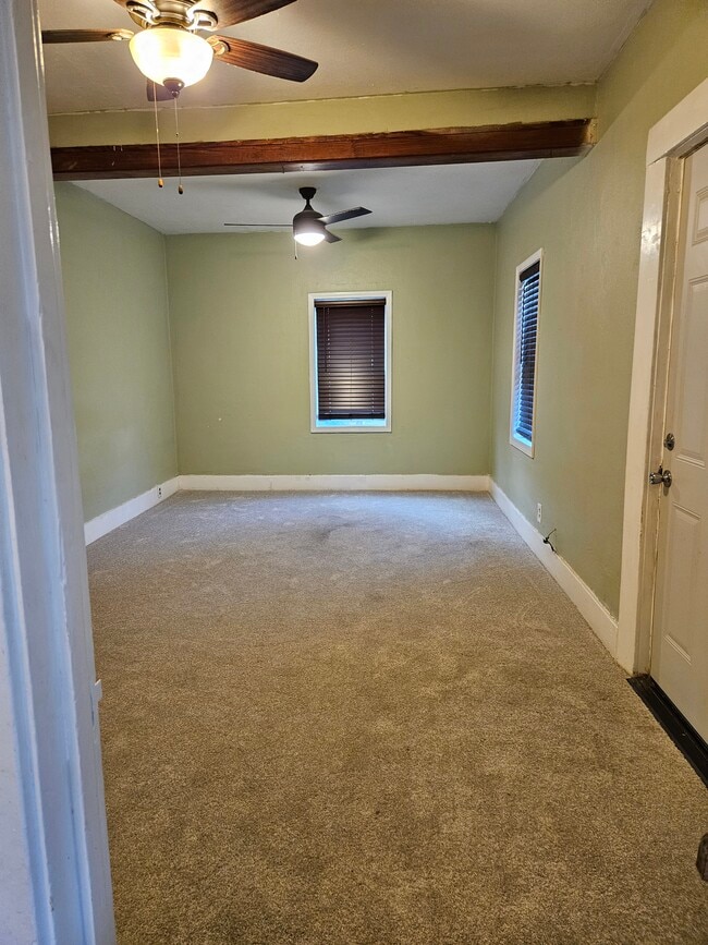 Living Room / Dining Room with new carpet and Energy Efficient Windows - 2905 Apple St