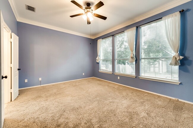 Master Bedroom- Downstairs. Note: this room is now a neutral (white) color, not shown in photo. - 1920 Parktree Dr