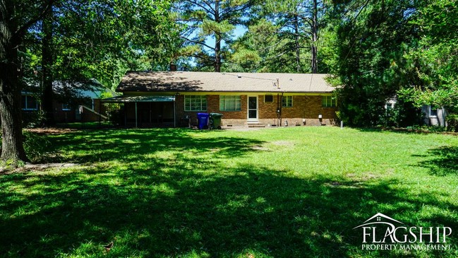 Building Photo - Cute Brick Ranch With Sunroom  Carport