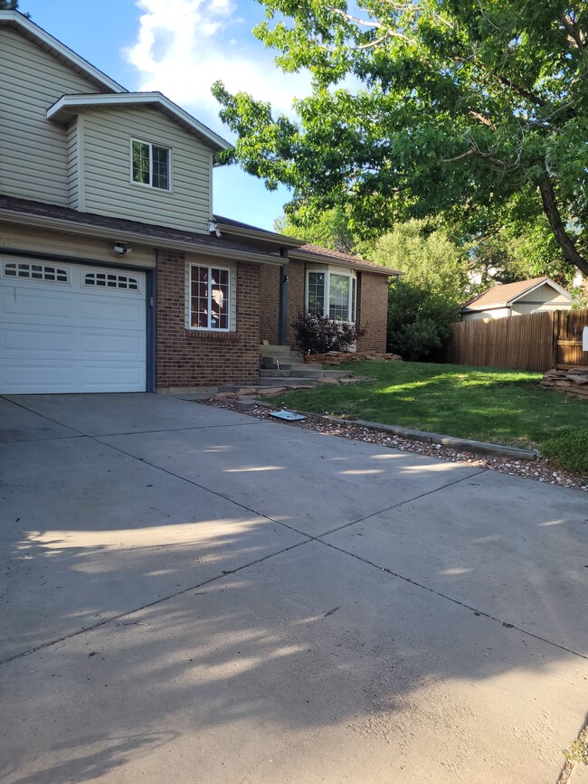 Front view. The window to the right of the garage door is the extra room in the Garage. - 18863 east milan