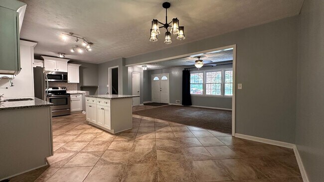 Building Photo - Spacious 4-Bedroom, 3-Bath Home with Moder...