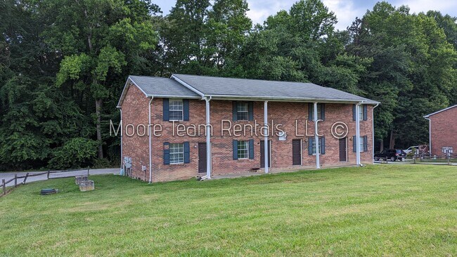 Building Photo - 2 Bed/1.5Ba - Includes - Water, Septic, Trash & Lawn Maint