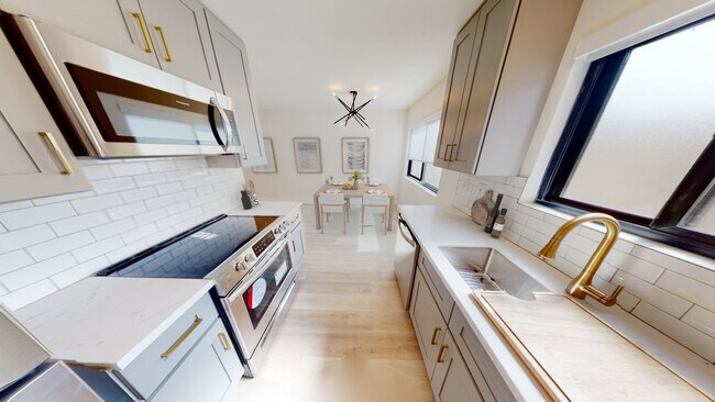 Cocina y comedor - Woodman Apartments