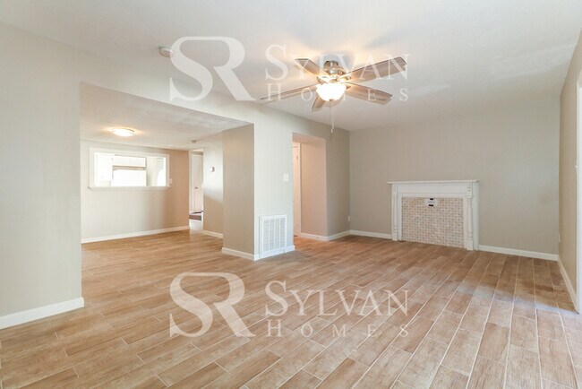 Building Photo - Venture outside to the expansive backyard,...