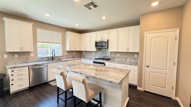 Building Photo - Spacious 5-Bedroom Home | Private Yard + Attached Garage