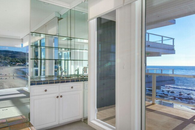 Building Photo - Stunning Ocean Front Oasis! 3 bedroom 2 bath condo with private steps to beach!