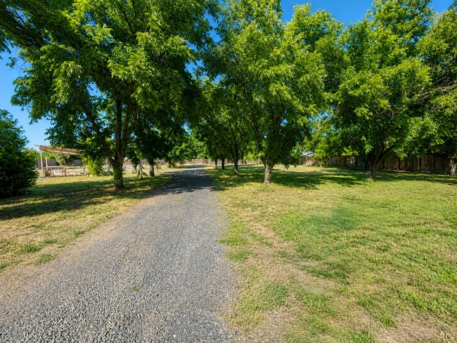 Building Photo - Private 3BR Home on Approx. 1 Acre | Huge Fenced Yard, Sunroom & 2-Car Garage