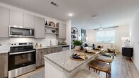Located on Moreland Avenue SE in Atlanta, GA, this well-appointed one-bedroom, one-bathroom residence offers a thoughtfully designed open-concept layout finished with contemporary details throughout. Light wood-look flooring flows seamlessly across the entire floor plan, tying each space together with warmth and continuity.

The kitchen serves as a central hub, showcasing granite countertops, a large island with breakfast bar seating, dual-tone cabinetry combining taupe uppers with wood-grain lowers, a white subway tile backsplash, and a full suite of stainless steel appliances. The space opens directly into the living room, which features a ceiling fan, large windows with ample natural light, and outdoor views.

The bedroom is a serene retreat with a generous footprint, large windows with outdoor views, a ceiling fan, and direct access to both the bathroom and a walk-in closet equipped with built-in shelving and hanging rods.

The bathroom continues the granite and wood-grain cabinetry aesthetic with a single vanity and a tiled shower/tub combination. Additional spaces include a dedicated entrance, hallway, and closet, rounding out a complete and functional floor plan ideal for comfortable everyday living.